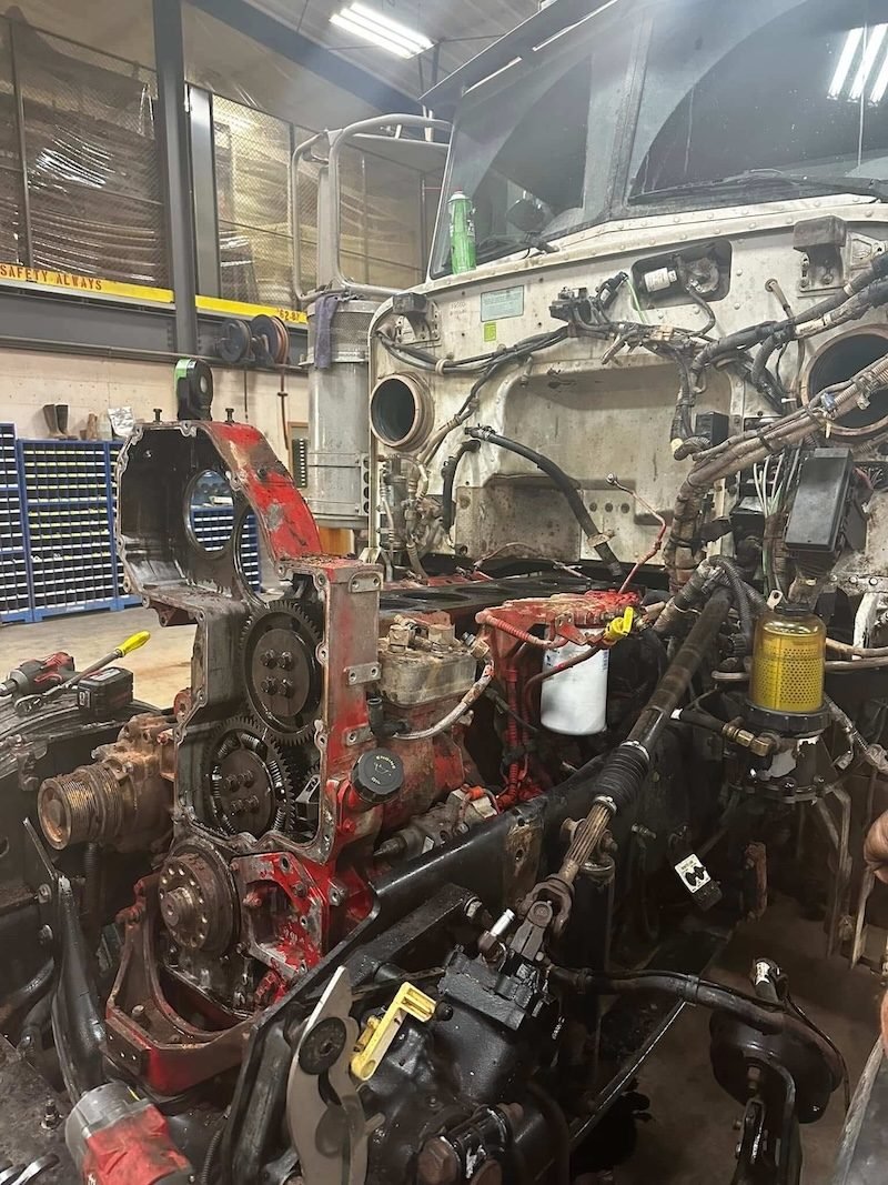 Front of a diesel engine exposed in a truck during repair
