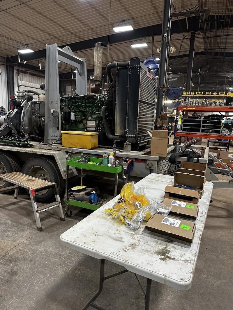 Parts laid out on a shop table during a heavy-duty truck repair
